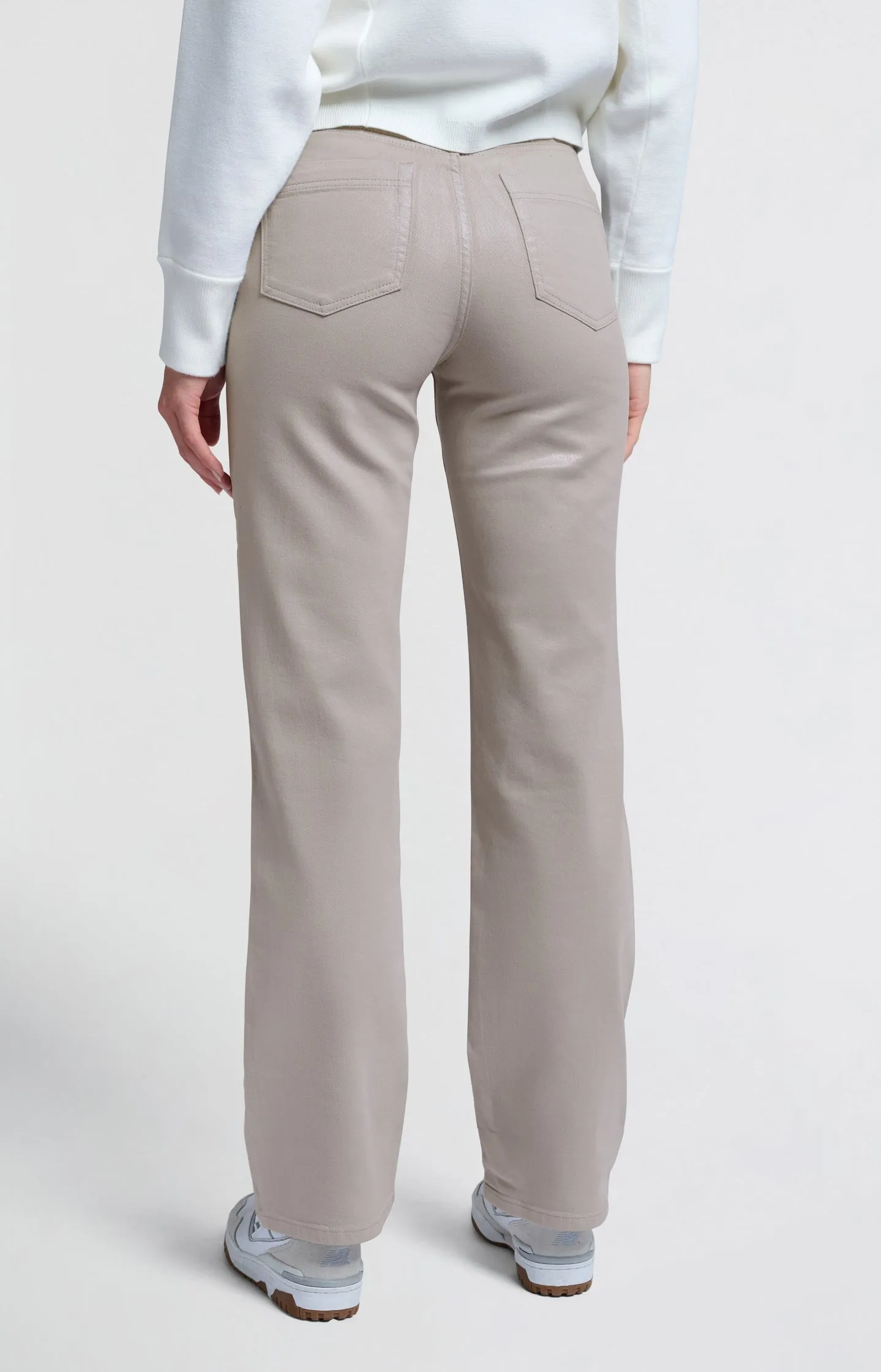 Coated denim trousers with wide legs and mid-rise waist